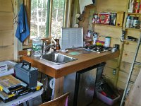 Kitchen counter now has stove, sink. More to do!